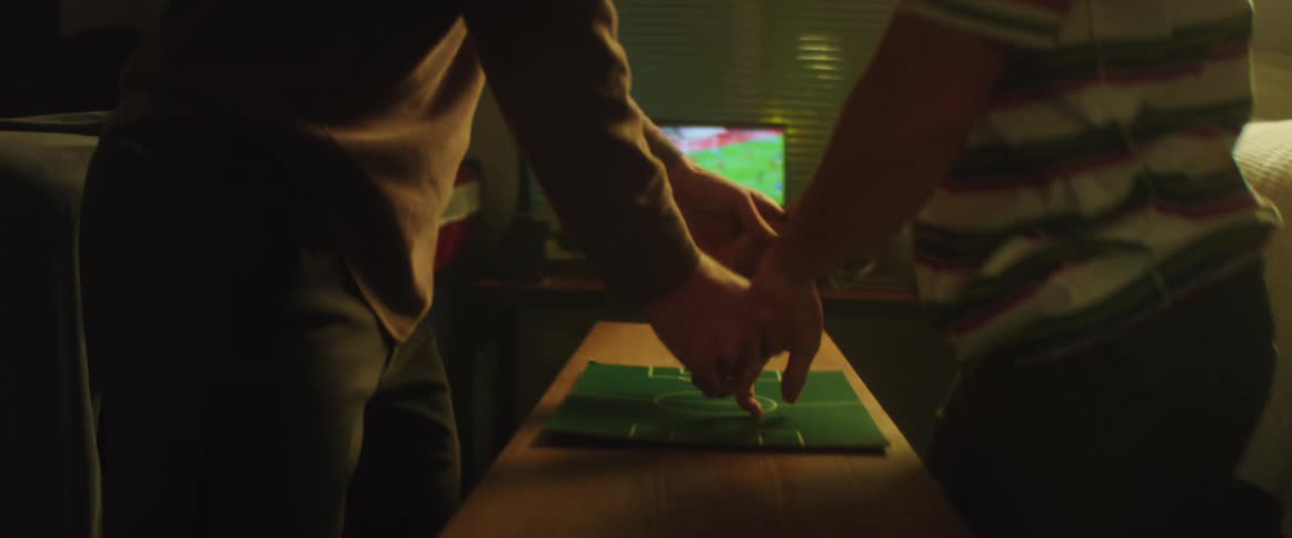 Two people are celebrating together indoors