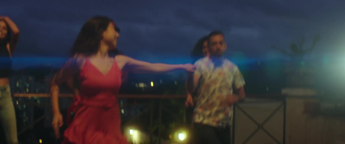 People are dancing at an outdoors night club