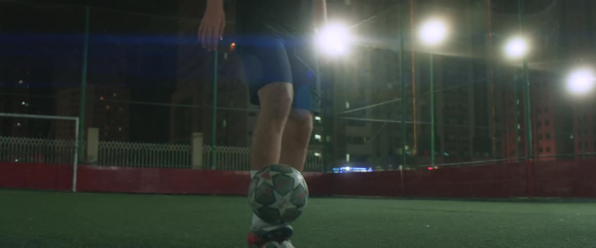 A man playing with a soccer ball outdoors