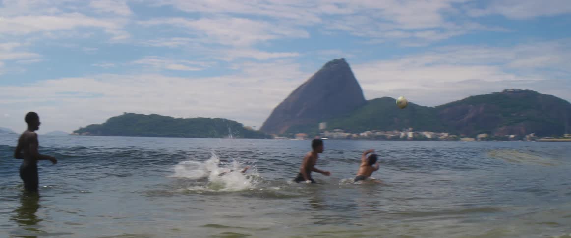 A group of kids are playing at the beach in spring