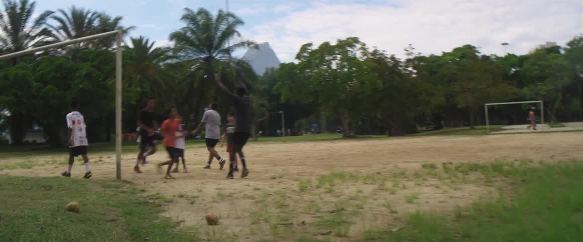 Teenagers playing football