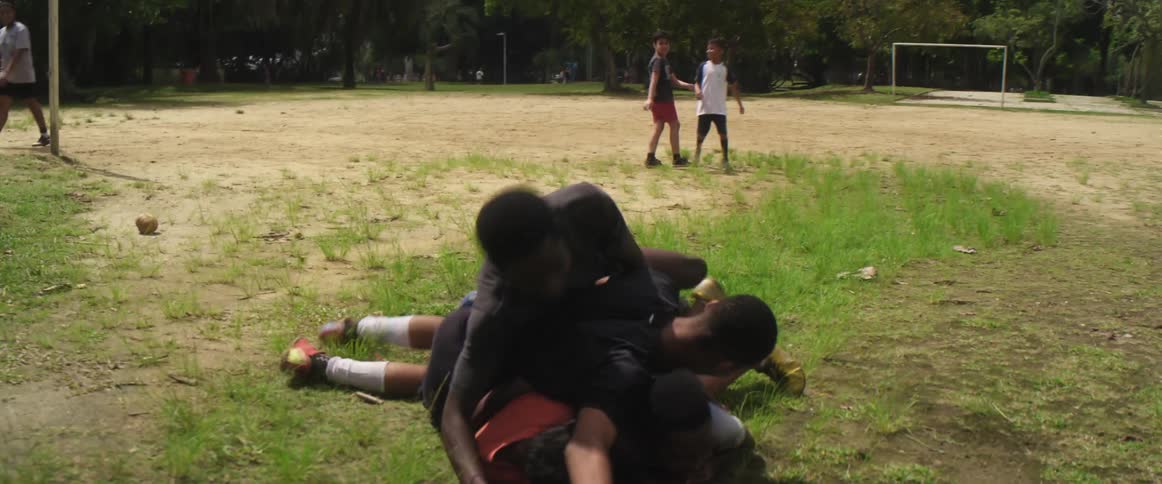 A group of kids are playing on a soccer field