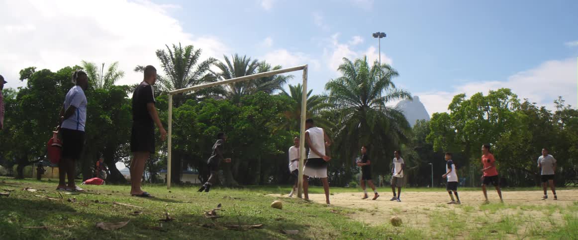 A group of people are playing soccer in spring
