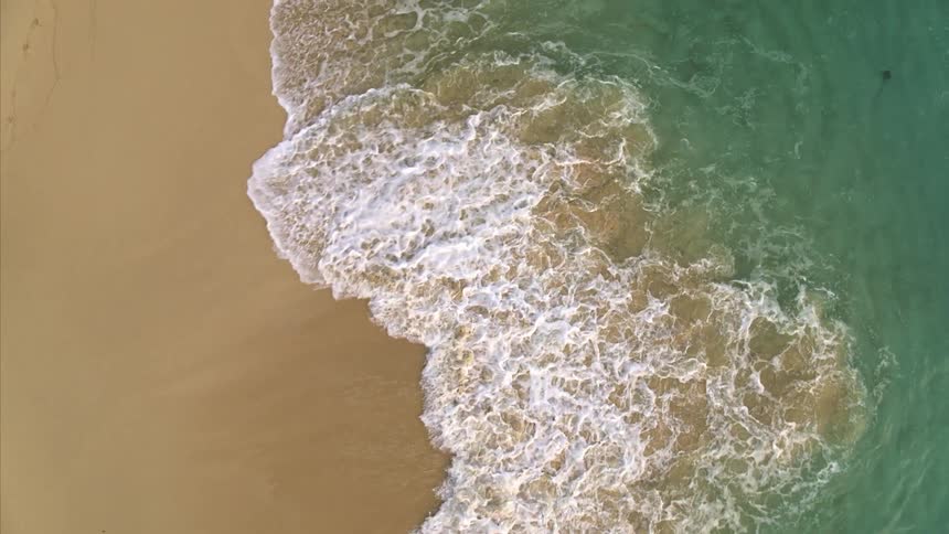 Ocean waves are moving towards the beach coast