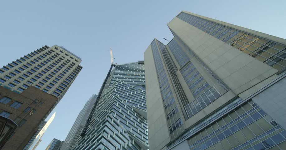 Tall skyscrapers towering overhead in a city on a clear day