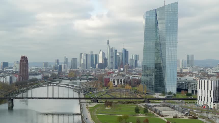 The sun is setting among the city skyline in spring