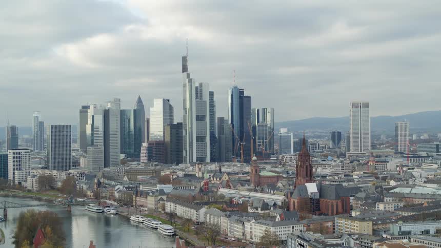 The buildings of a metropolis under a cloudy daytime sky