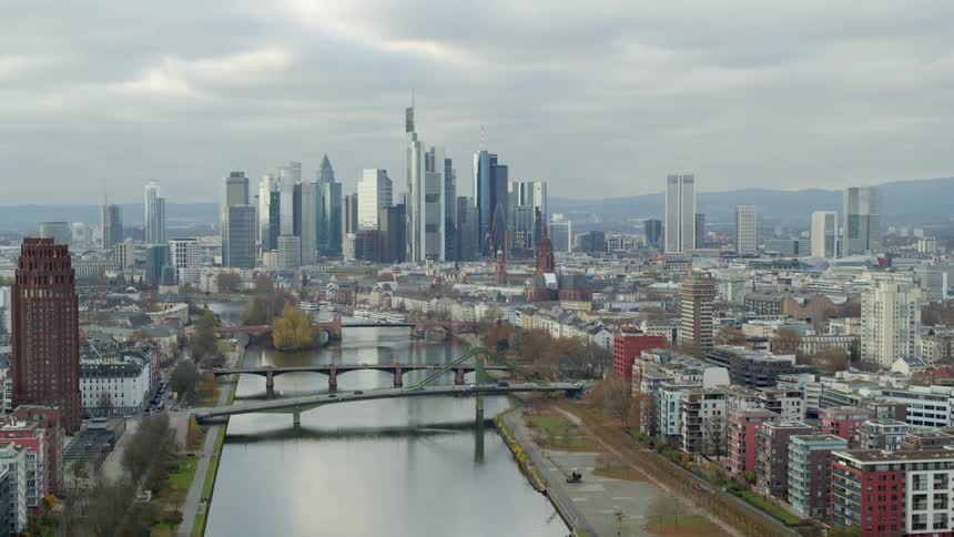 A river running through a large city with skyscrapers in the distance