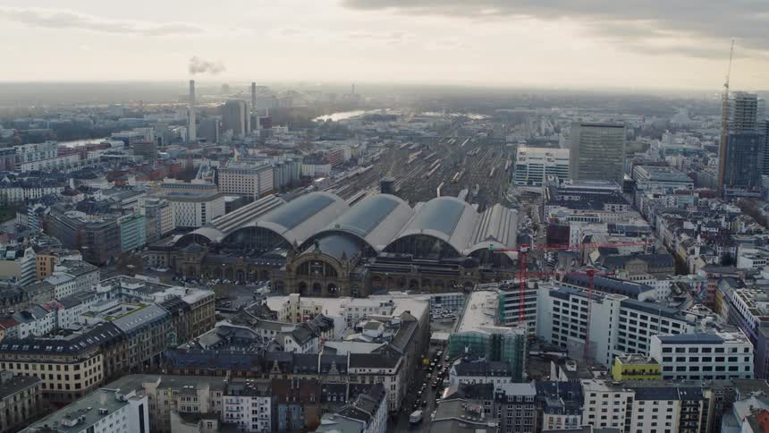 Aerial view of a downtown city at dusk is displayed