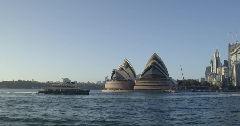 A sightseeing boat travels past a point of interest on the coast