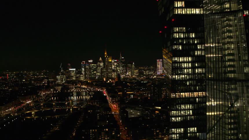 Big city towers and skyscrapers and the skyline lit up at night