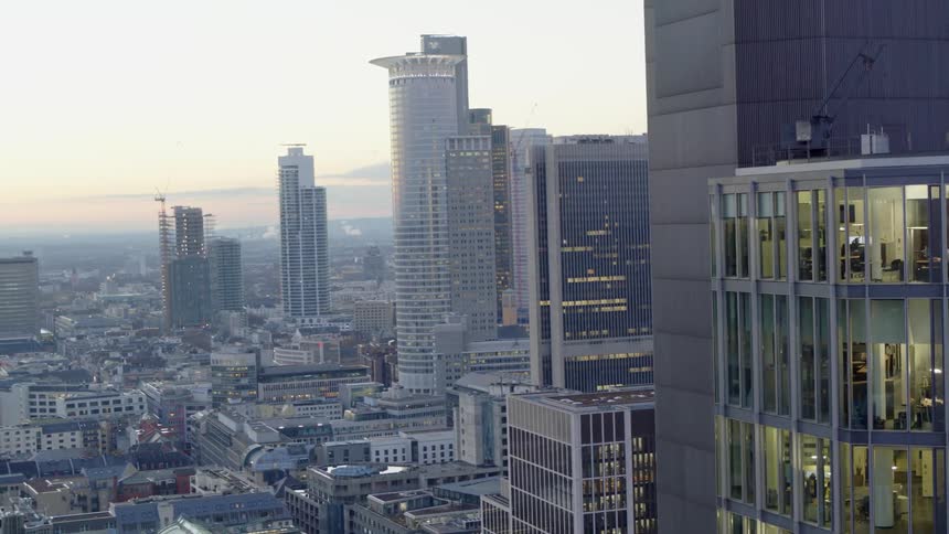 Aerial view of a downtown city and buildings at dusk