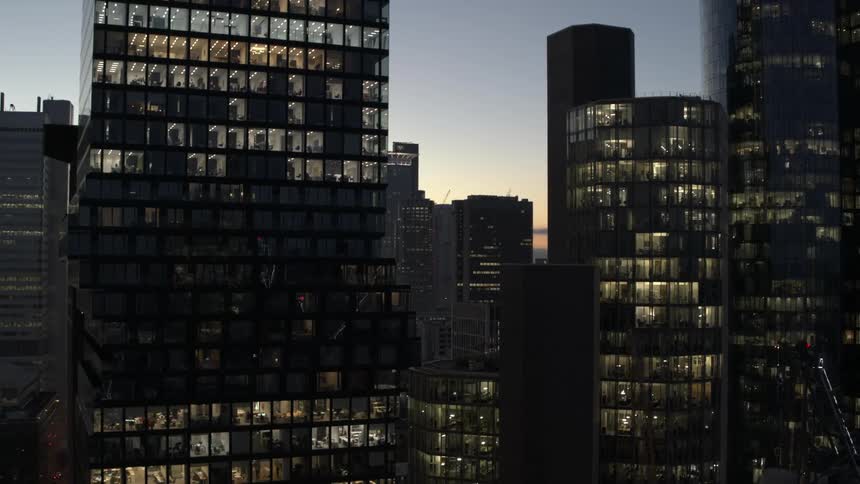 Aerial view of skyscraper buildings downtown at dusk