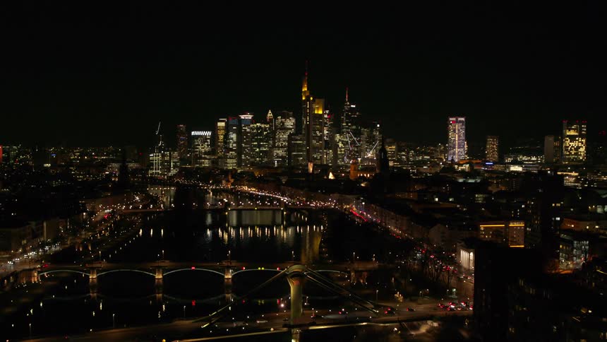 Aerial view of a city is displayed at night