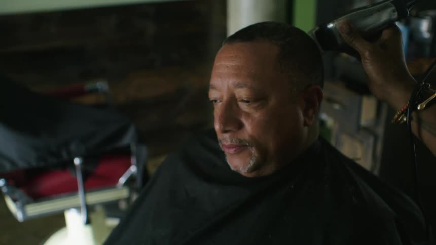 Black male receiving haircut
