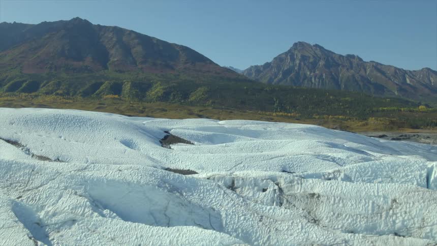 Aerial view of mountains in winter is dispalyed