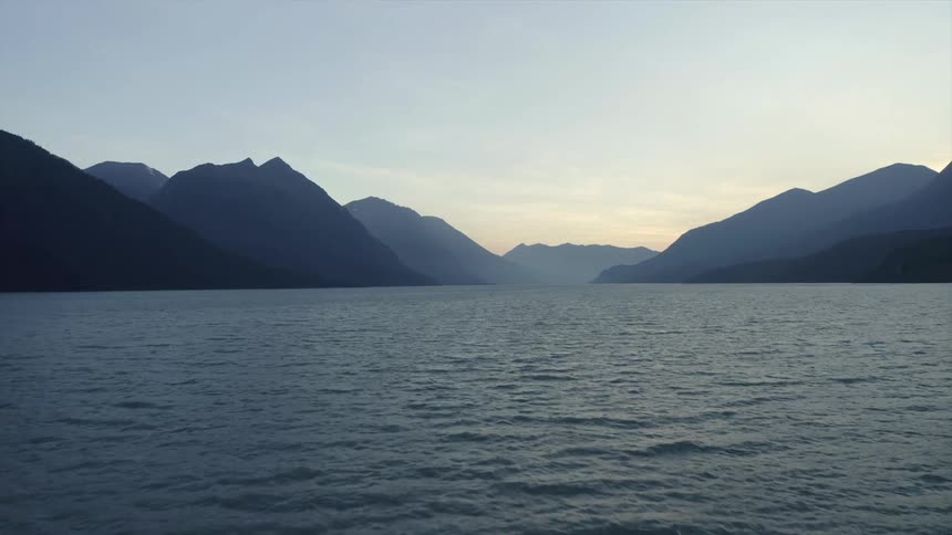 The water waves and ripples with mountains in the distance