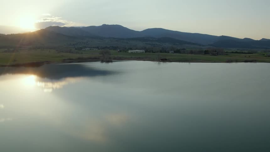 A lake in the countryside on a clear evening