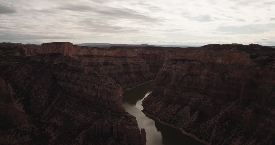 Time lapse of a river flowing through a mountain range