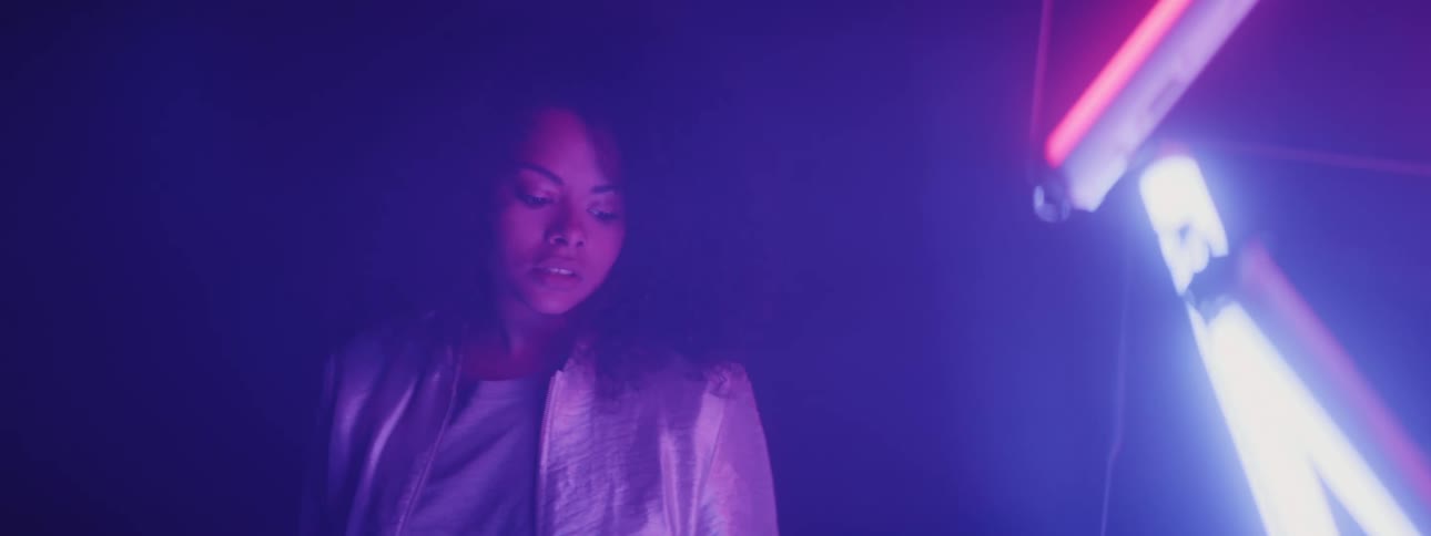 A woman looking at colorful lights