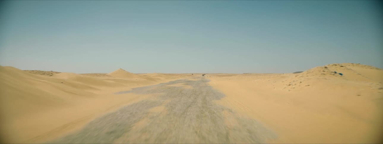 View of road in desert with sand dunes