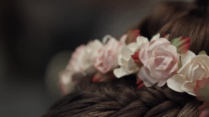 Close up of flowers in a person's hair