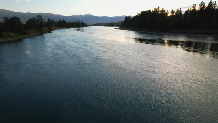 An aerial view flying over a river