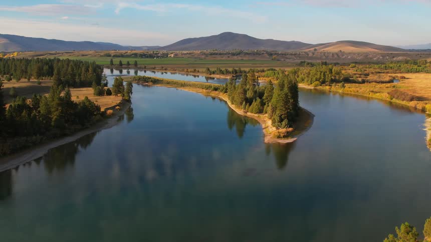 Aerial view of open water and a landscape is displayed