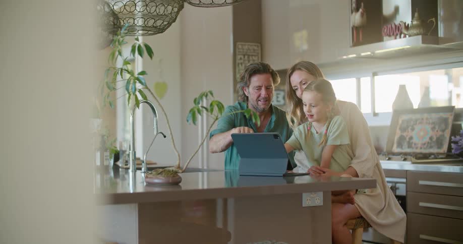 A family talk and look at a tablet together
