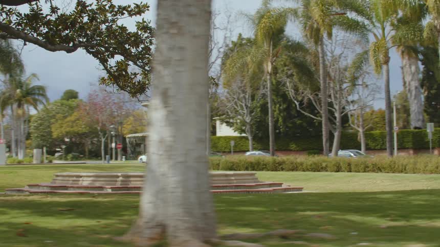 View of city park and splashing fountain
