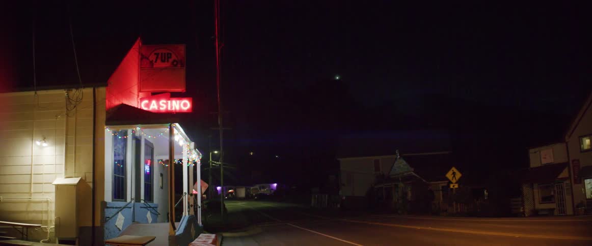 A casino on an empty street at night