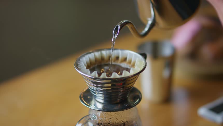 Coffee is being brewed indoors during the day