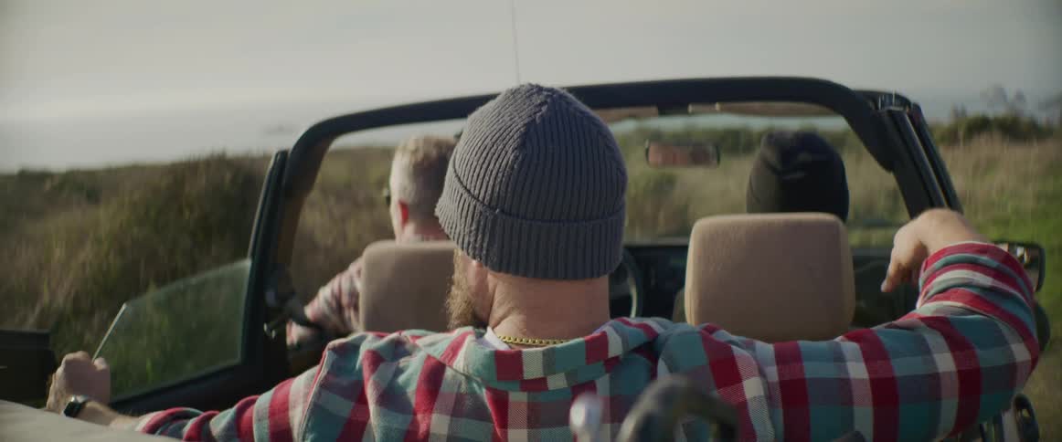 A group of people sitting out in a car