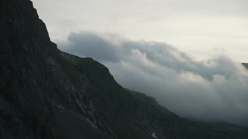 The clouds are touching the mountain top