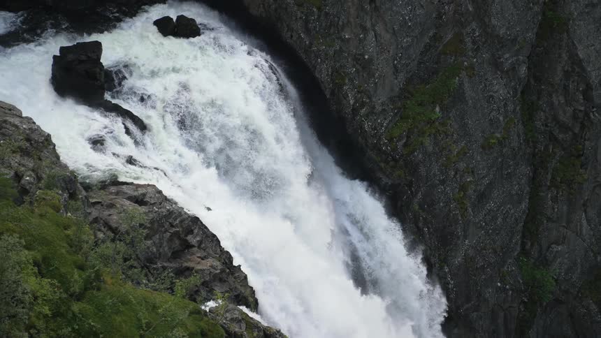 Closeup of a rapid waterfall rushing down the canyon