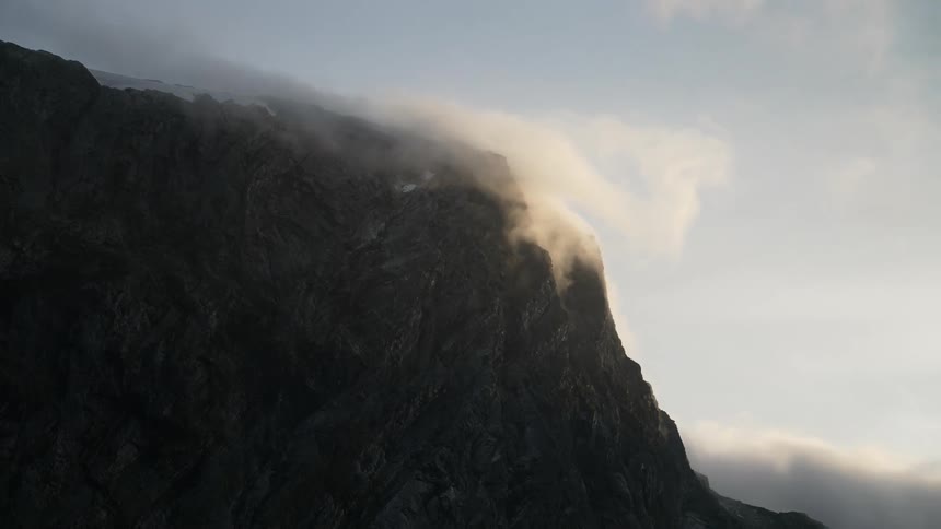 Cloud flowing over mountain
