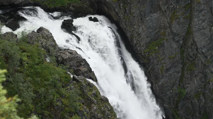 A steep waterfall in the wilderness during the day
