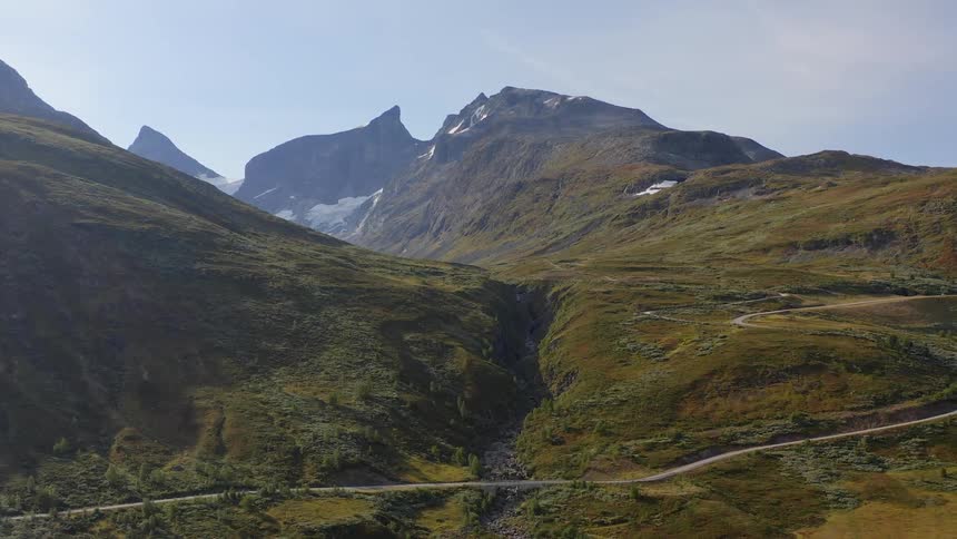 Aerial view of a road on the slopes of a mountain range