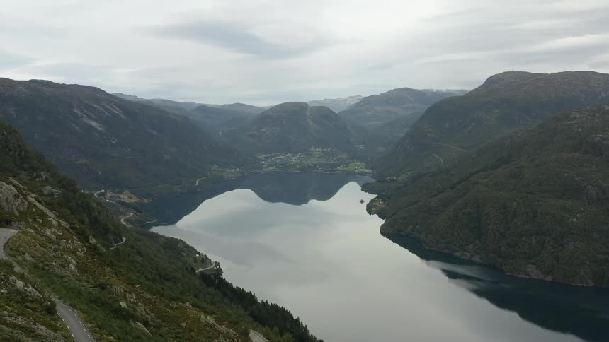 Aerial view of mountains and a river is displayed