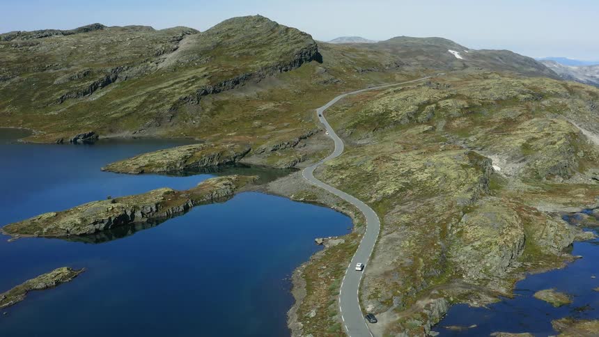 An aerial view of hills with lakes