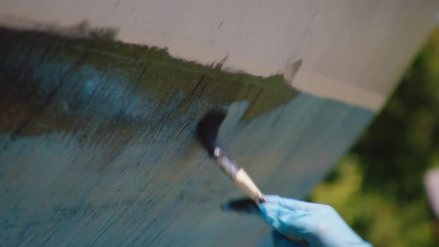 A person is outdoors and painting in spring