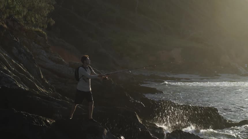 Person fishing in ocean