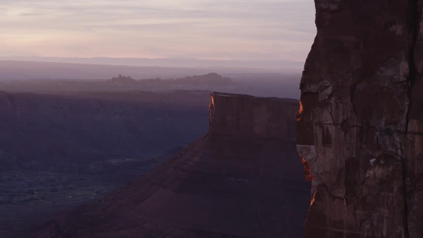 Fog covers valley between plateau topped mountains