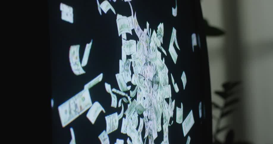 A television with money on the screen in a home