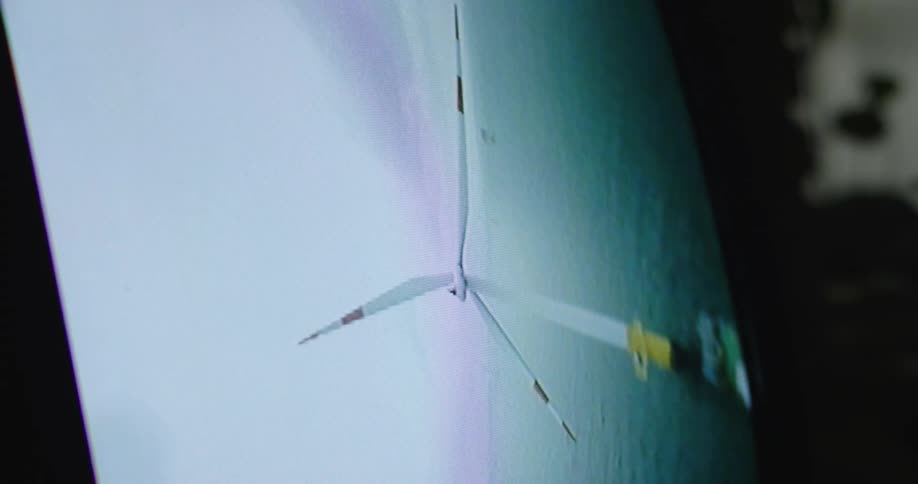 The television is displaying a moving windmill