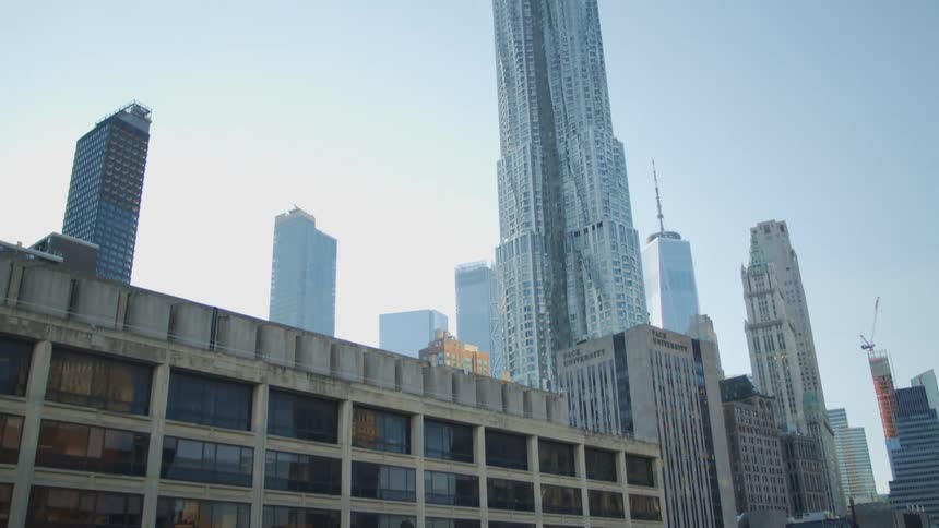 Aerial view of buildings in a city at midday