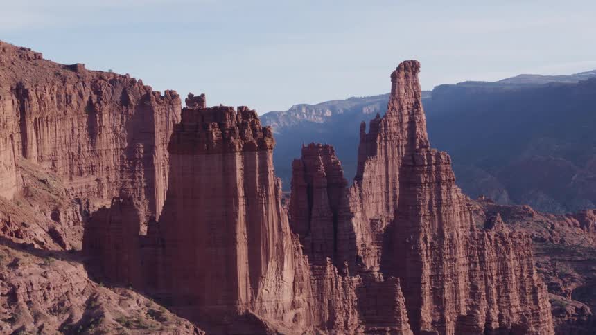 The tall rock formations cover the canyon