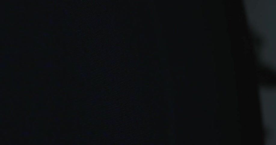 Lightning on the screen of a vintage television inside a dark room