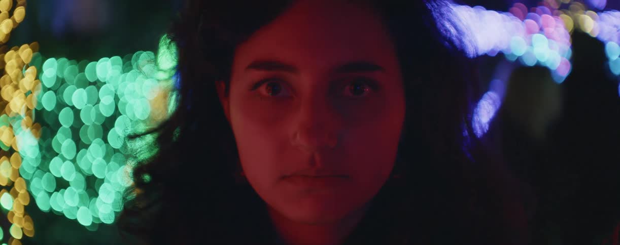 A woman is staring in front of the lights