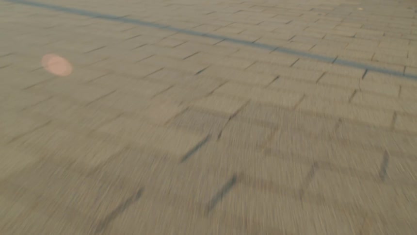 A brick sidewalk in a city